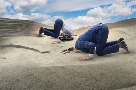 The Businessman Hiding His Head In Sand Escaping From Problems Stock