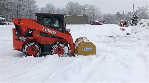 Kubota Ssv75 Skid Steer With An Hla Snow Pusher