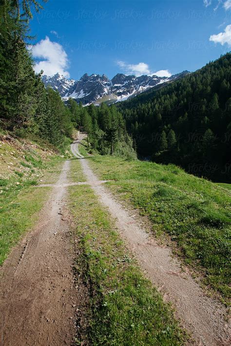 Dirt Road In The Alps By Stocksy Contributor Davide Illini Stocksy