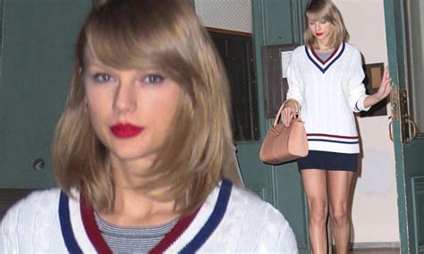 Taylor Swift Pairs Cable Knit Sweater With Tiny Mini Skirt Daily Mail