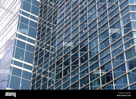 Skyscraper Facade With Glass Facade And Reflections Stock Photo Alamy