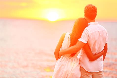 honeymoon couple romantic in love at beach sunset newlywed happ relationship couples
