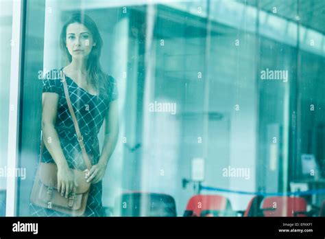 Woman Behind Glass Window Stock Photo Alamy