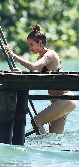 Irina Shayk Wears Black Bikini As She Enjoys Lake Swim With Shirtless