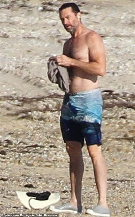 Hugh Jackman Shows Off His Ripped Physique As He Goes For A Swim