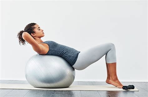 The Exercise Ball Back Stretches You Should Be Doing Daily Wellgood