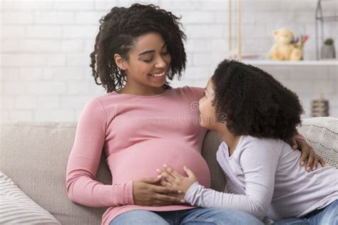 Second Pregnancy Pregnant Black Woman Bonding With Little Daughter At