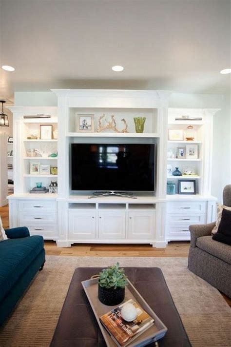 This decorating move keeps the space looking calm and collected but adds some visual interest when the television is not on. 15+ Best Shelves Entertainment Center Design You Need to Know - DECORATHING - Family room layout ...
