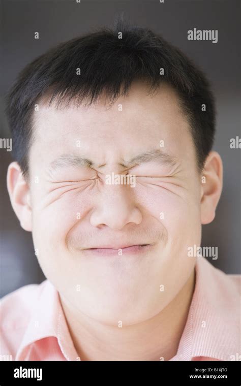 Close Up Of A Teenage Boy Giving A Disgusting Facial Expression Stock