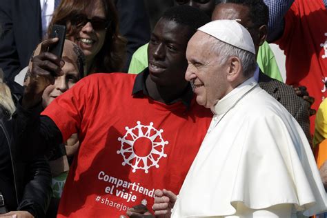 Pope Francis Embraces Migrants As He Launches Awareness Campaign