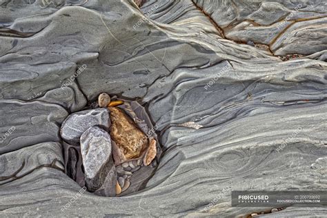 Natural Pattern Of Eroded Rock Face On River Bank Full Frame