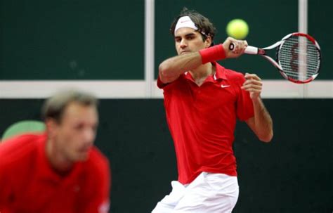 Learn the truths about roger's topspin forehand. roger federer forehand follow through.jpg