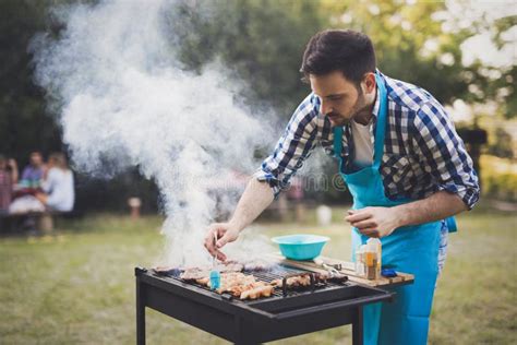 Handsome Man Preparing Barbecue Stock Photo Image Of People Eating