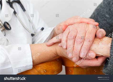 Photo Caregiver Hand Touching Elderly Patients Stock Photo 522494110