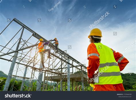 Engineer Technician Watching Team Workers On Stock Photo 1737846938