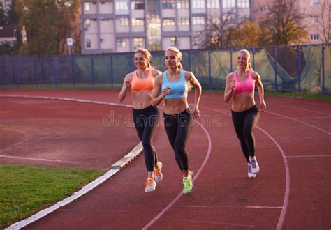 Athlete Woman Group Running On Athletics Race Track Stock Photo Image