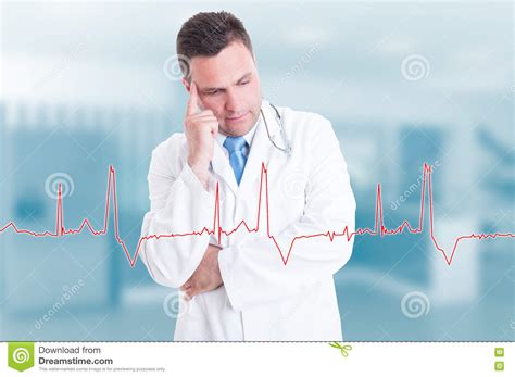 Thoughtful Young Doctor With Heartbeat Graph On Screen Stock Image