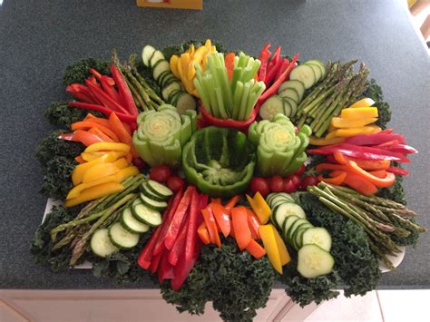 A Bunch Of Vegetables That Are On Top Of A Table In The Shape Of A