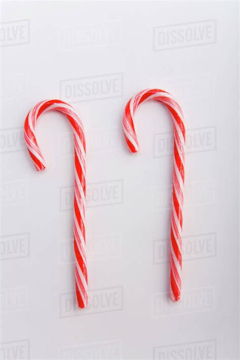 Two Stripped Christmas Candy Canes On White Background Studio Portrait Stock Photo Dissolve