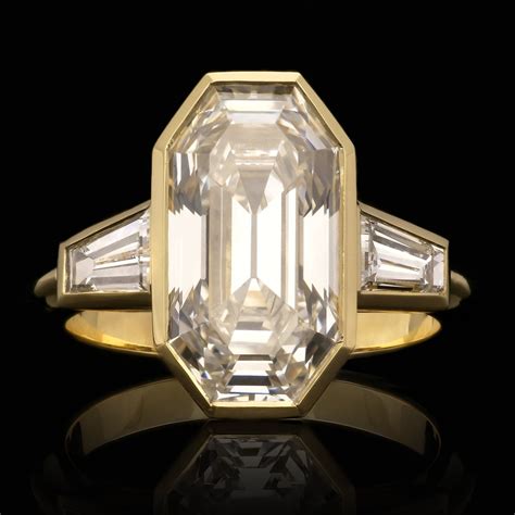 538ct Old Emerald Cut Diamond Bezel Set In 18ct Gold Ring With Tapered