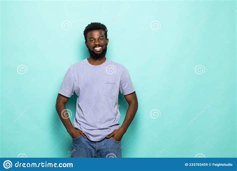 African American Man Laughing Against Turquoise Background Stock Image