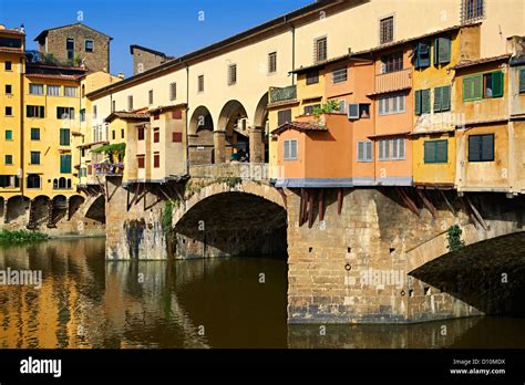 The Ponte Vecchio Bridge With Its Shops Spanning The Arno River