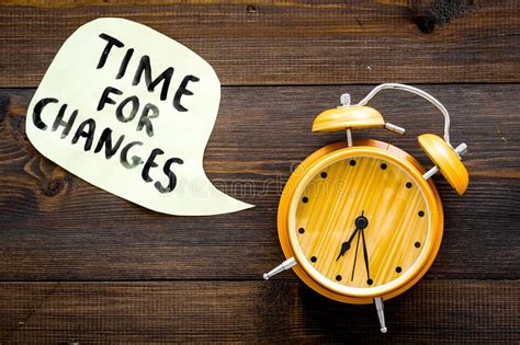 Time For Changes Hand Lettering Near Alarm Clock On Dark Wooden