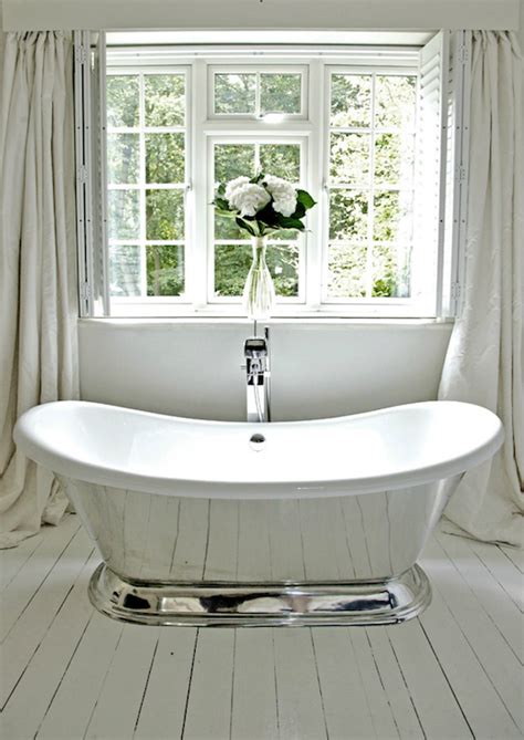 In this bathroom, white coats every surface, except the wood vanity, to maximize the bright, expansive effect. White Plank Floor - Transitional - bathroom - 1st Option
