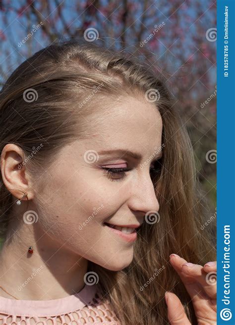 Beautiful Blonde Woman In Pink Dress And Ladybug Insect Stock Image