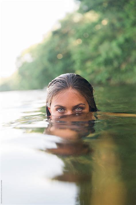 Beautiful Eyes Of Girl Submerged In Lake By Stocksy Contributor