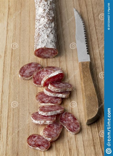 traditional catalan sausage fuet and slices on a cutting board stock image image of