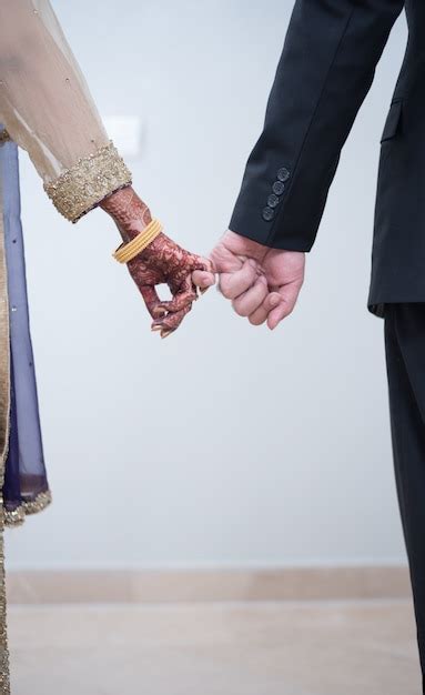 Premium Photo Pakistani Indian Brides Groom Holding Hands