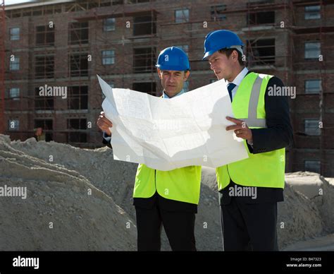 Architects On Building Site Stock Photo Alamy