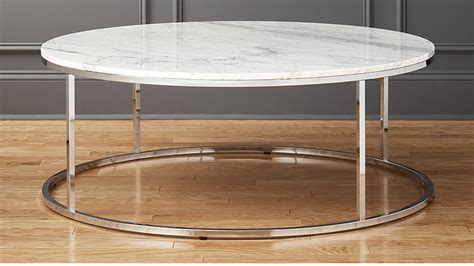 Brushed gold or copper with brown marble or brushed gold, copper or stainless steel with matt white marble, $2,490.00. Smart Large Round Marble Top Coffee Table | CB2