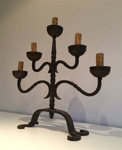 Vintage black wrought iron 4 candle stick hanging candle holder a pretty vintage refurbished hanging candle holder of wrought iron with a dark blue finish. Wrought Iron Candle Holder, 1920s for sale at Pamono