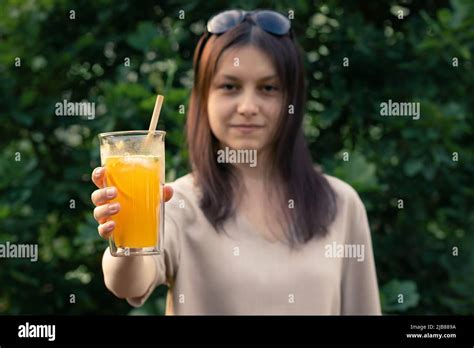 A Glass Of Fresh Orange Juice With A Straw Hi Res Stock Photography And
