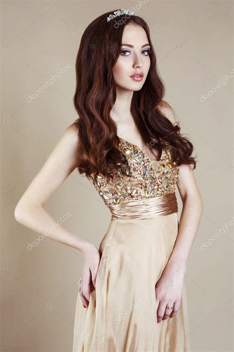 Beautiful Girl With Luxurious Dark Hair In Sequin Dress Posing At Studio Stock Photo By Slava