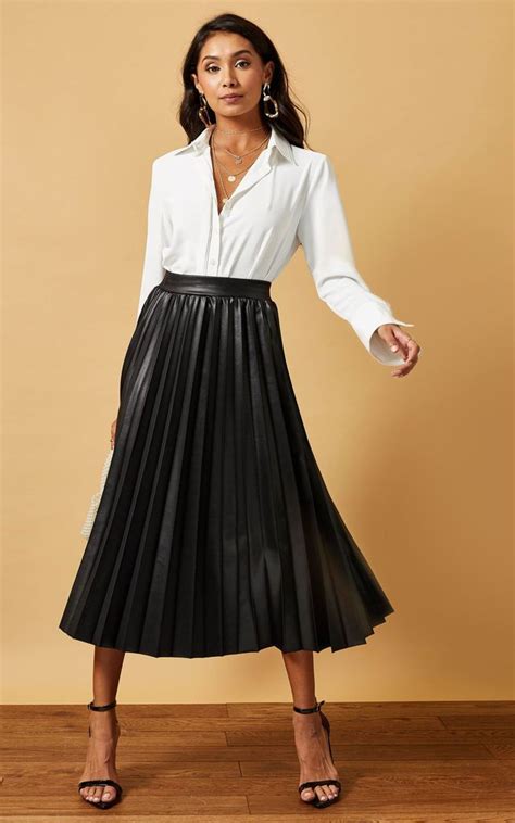 black pleated midi skirt in coated jersey phoenix and feather silkfred us black pleated midi