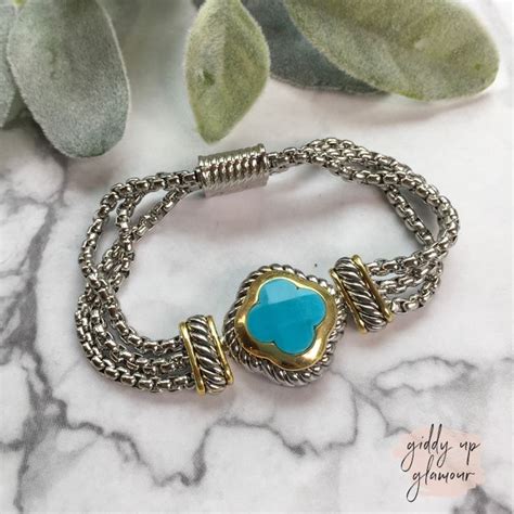 This Bracelet Is A Two Toned Bracelet With A Turquoise Stone With Gold