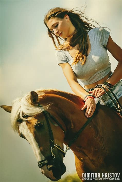 A Beautiful Girl Is Sitting On A Horse And Stroking It 54ka Photo Blog