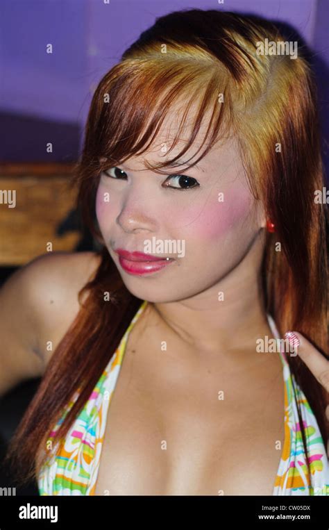 Sexy Asian Philippine Prostitute Bar Girl With Fancy Colorful Make Up And Wide Open Décolletage