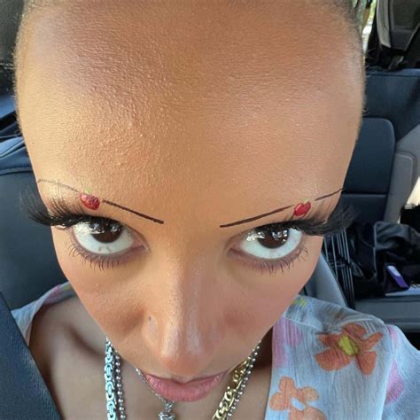 Doja Cat slams critics of her shaved head: 'Go f—k yourselves'