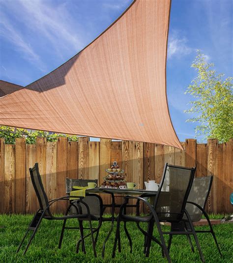 Do you wish your backyard was a little more shaded and secluded? DIY Coolaroo Shade Sails | Shade sail, Coolaroo shade sail ...