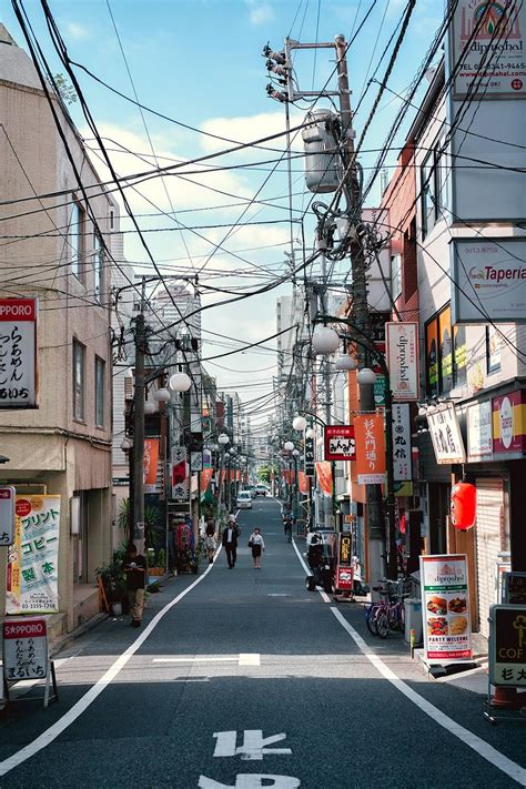 A Small Street With A Bunch Of Power Lines In Shinjuku Oc