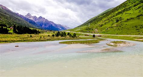 The River And Green Mountain Landscape At Tibet China Stock Image