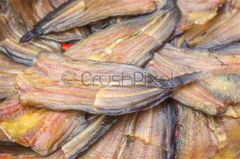 Making Dried Fish Dry Salted Fish On Threshing Basket Background