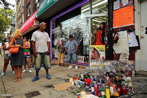 People Attend A Vigil For Eric Garner Near Where He Died After He Was