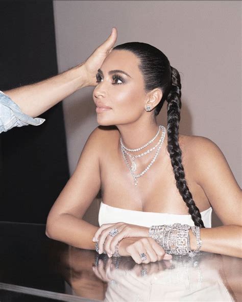 The hairdo shows oozes sophistication and style. Pin by Emma Reds on Kim Kardashian | Kim kardashian hair ...