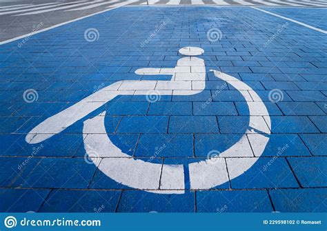Handicapped Symbol Painted On A Special Parking Space For Disabled