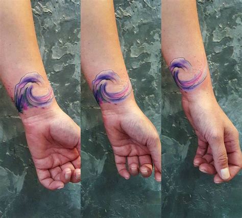 Watercolor Style Wave Tattoo On The Left Wrist